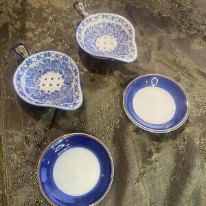 Two Vintage Bombay Company Tea Strainers with Saucers